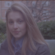 Full 16mm frame of Jennie in the Adams House courtyard from Camera Noise